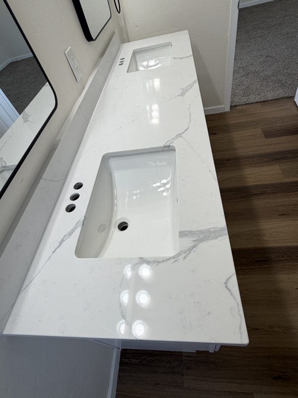Close-up of quartz vanity countertop and sink cutout