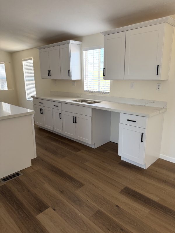 White shaker kitchen with new quartz countertops